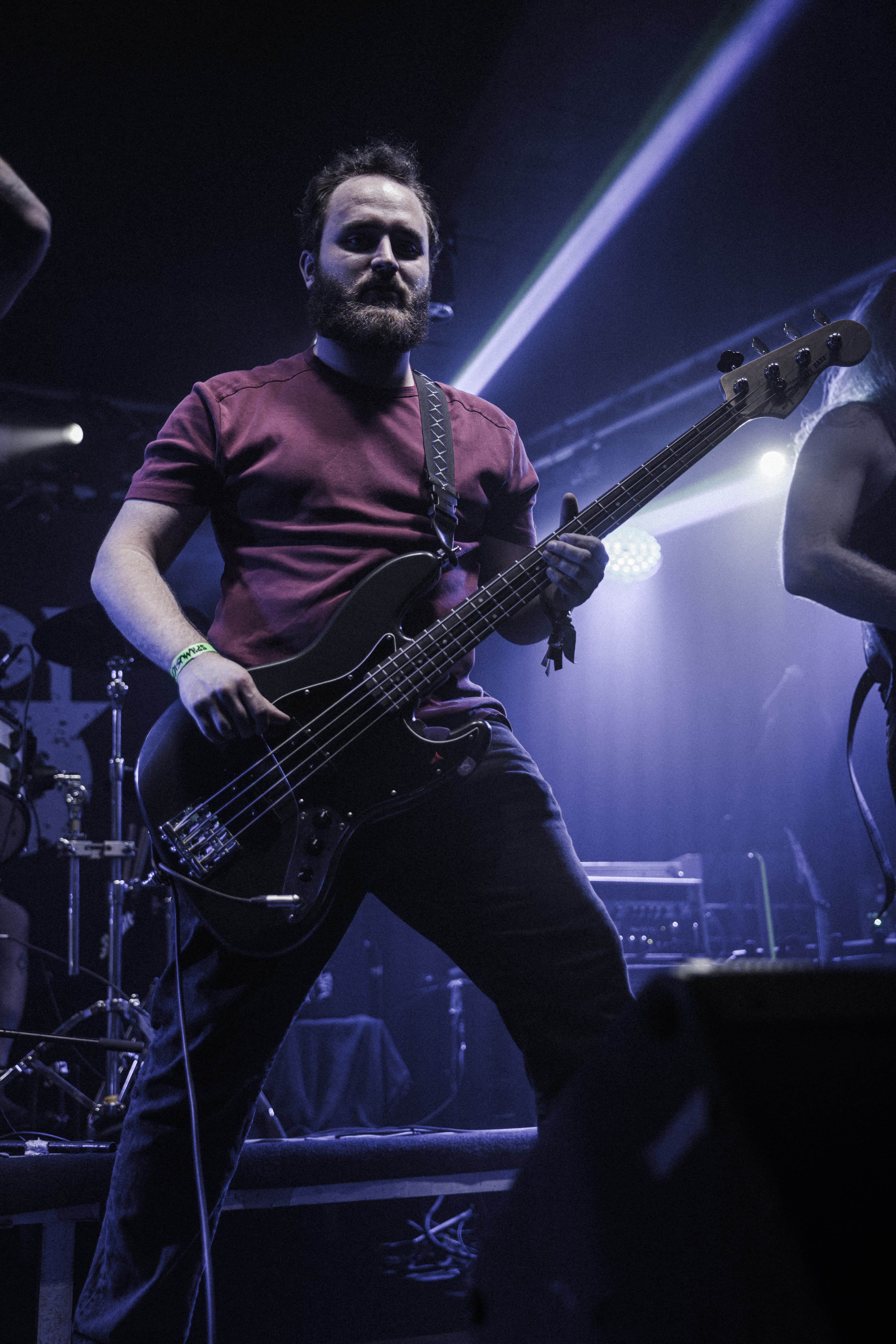 Tears of God bassist performing live on stage