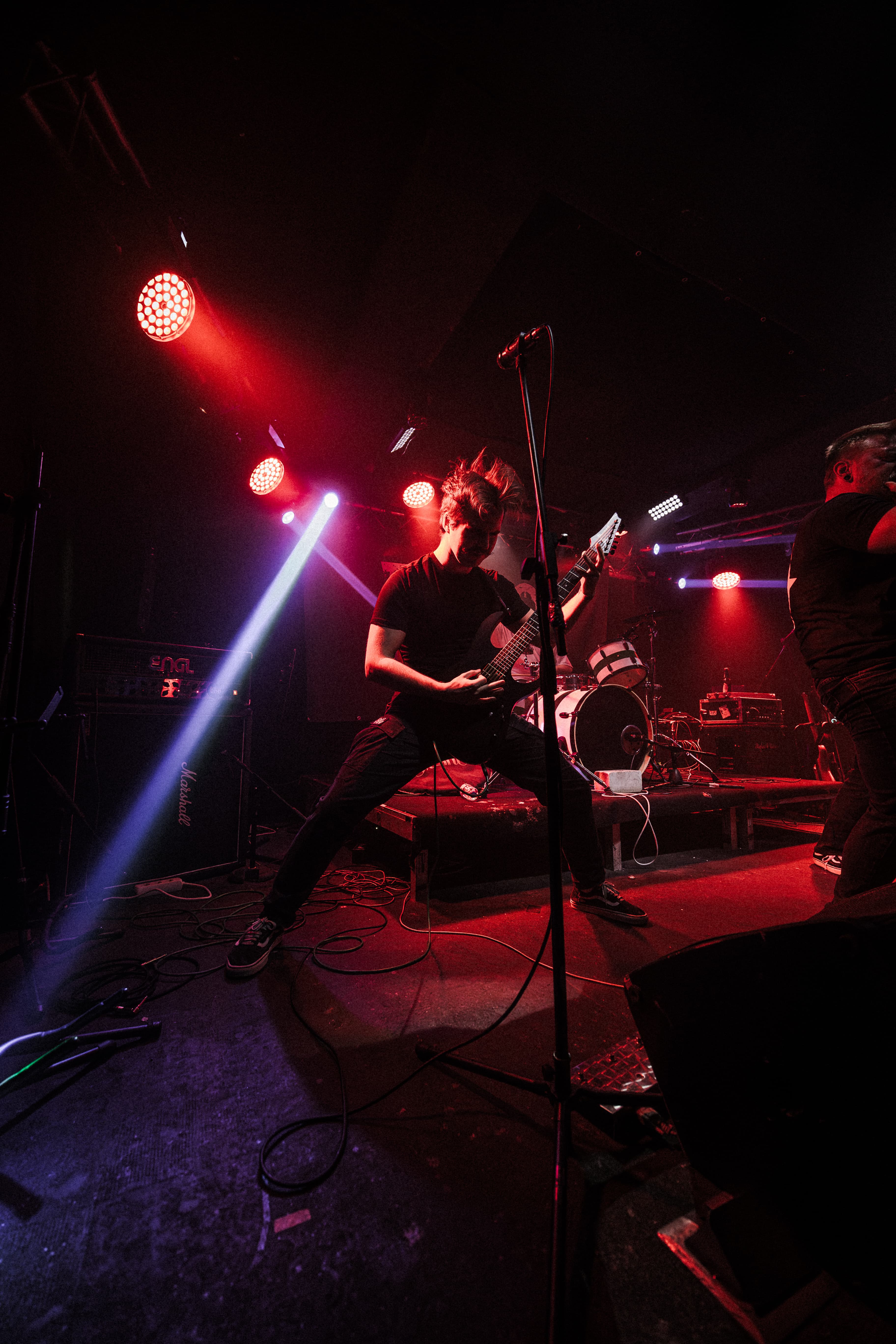 Tears of God guitarist performing live on stage